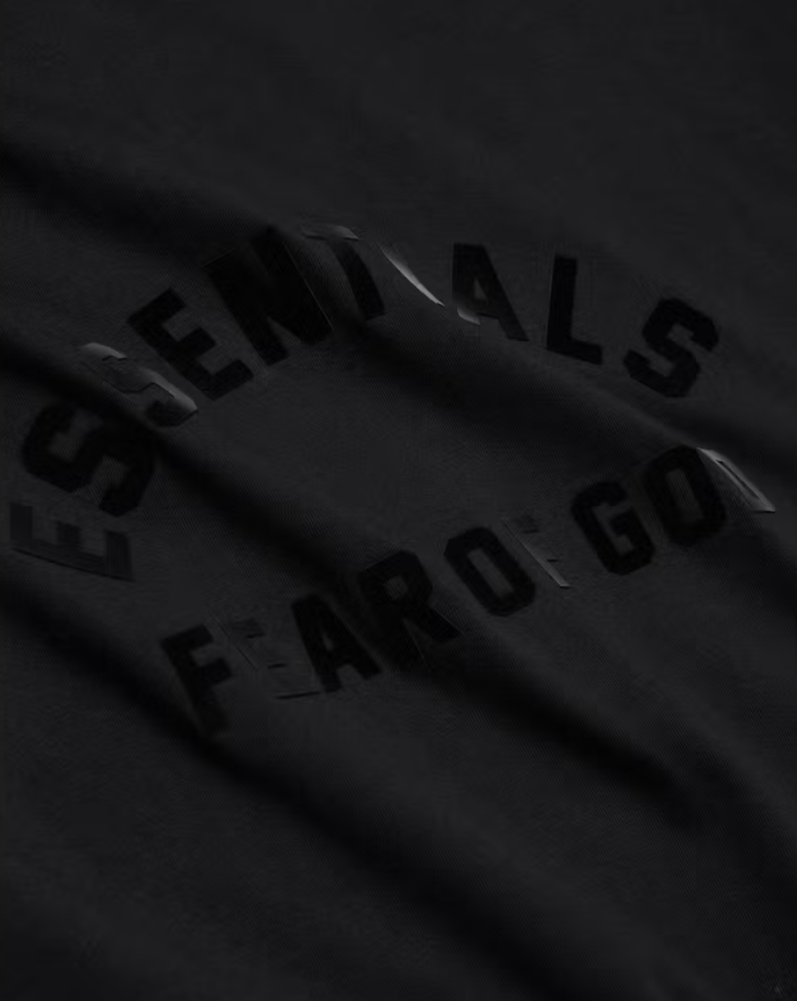 ESSENTIALS JET BLACK ARCH TEE